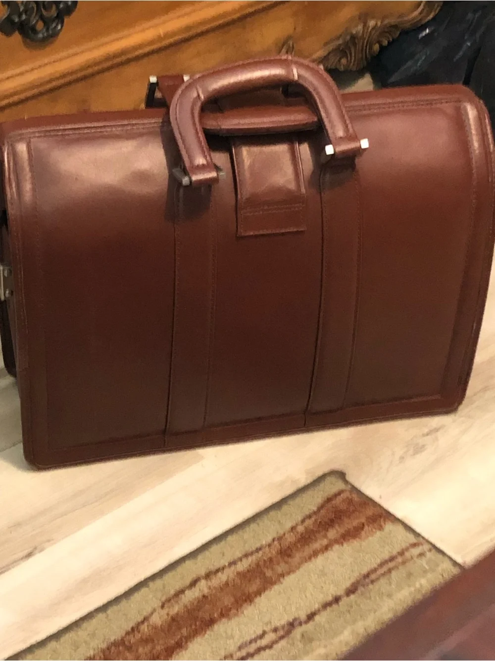 Litagator leather briefcase with security features and sturdy handles.